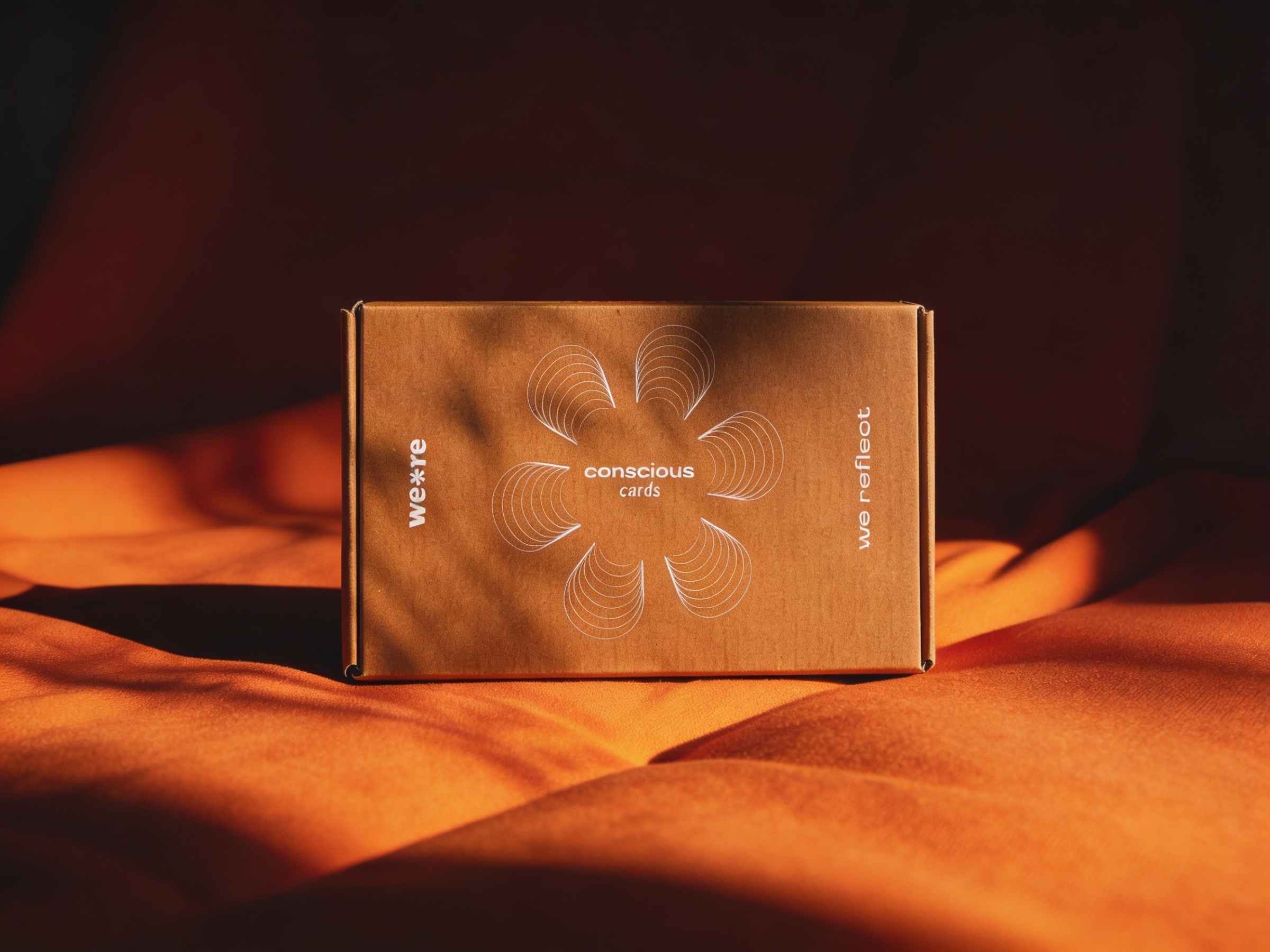 conscious cards packaging in dramatic orange light