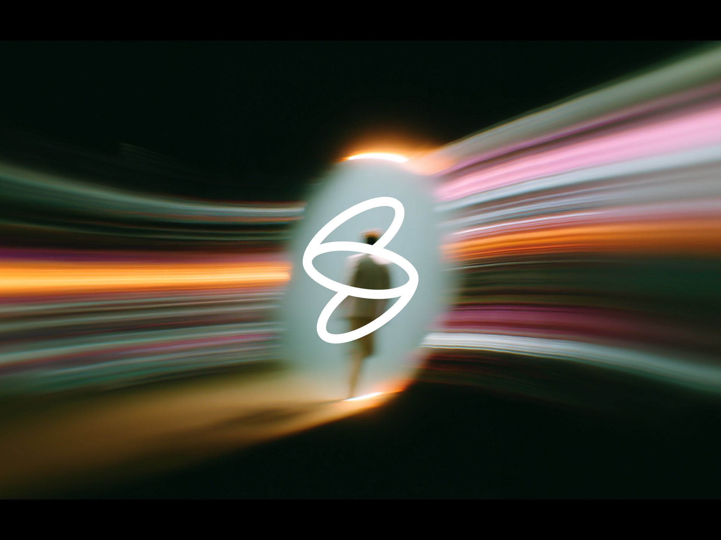 brand mark in motion, light streaks across the frame
