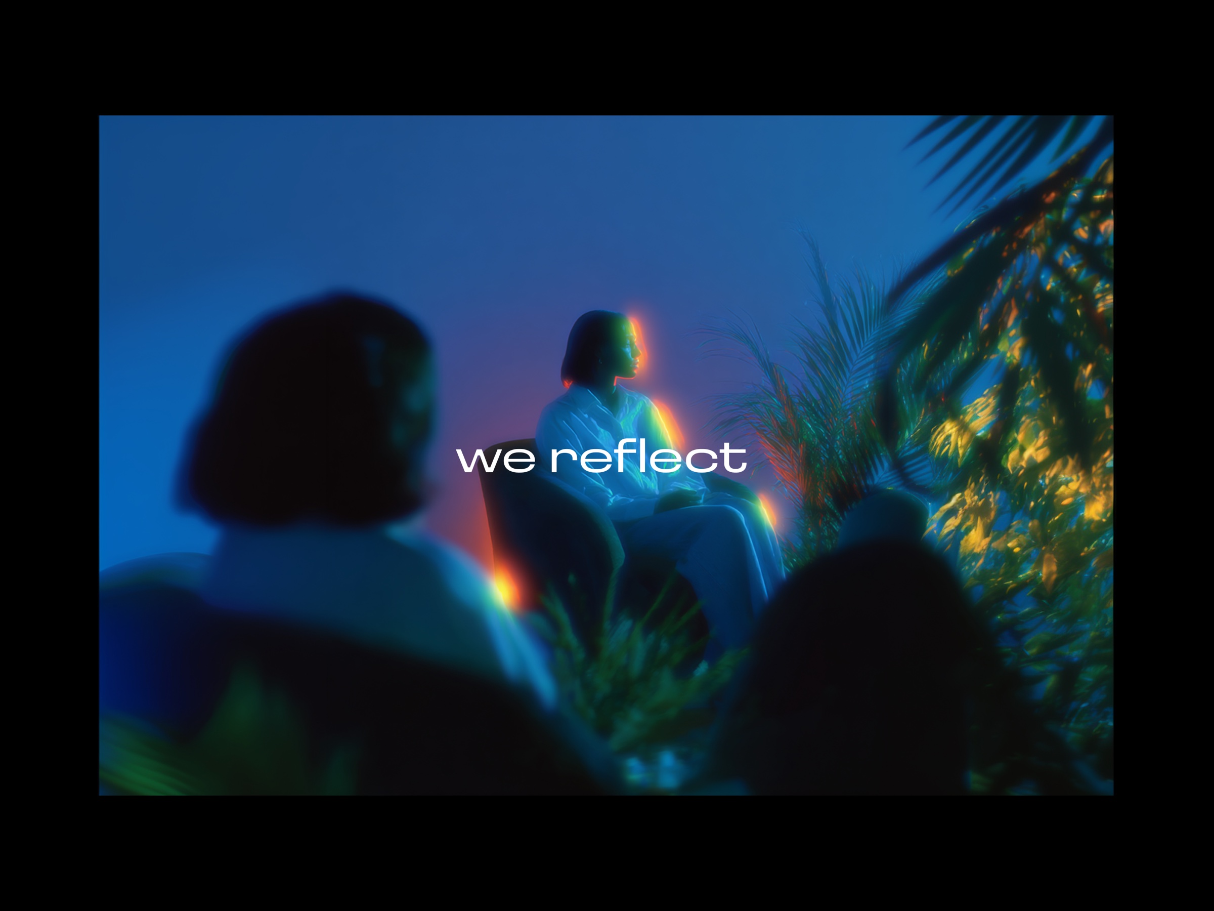 we reflect brand film still, two figures, evening light, plants